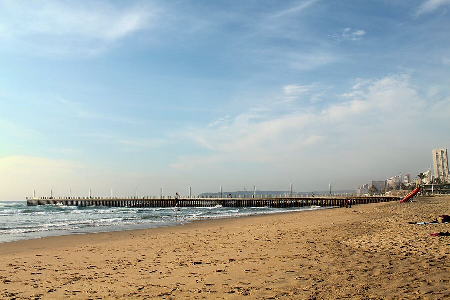 The pier at Durban North Beach, seen across the sand and the sea