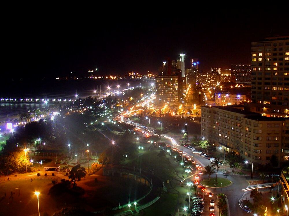 The Durban beachfront at night, the Golden Mile lit up along the curve of the bay